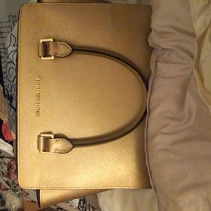 Michael Kors Medium Rose Gold purse. Handles or shoulder .